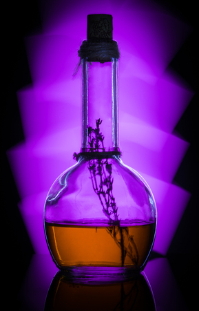 Bottle of whiskey with lightの写真素材