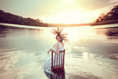 beautiful girl with a wreath on his head , sits on a rock near the fabulous Lake
fantastic shooting near water fairy image
fashion creative color toningの写真素材