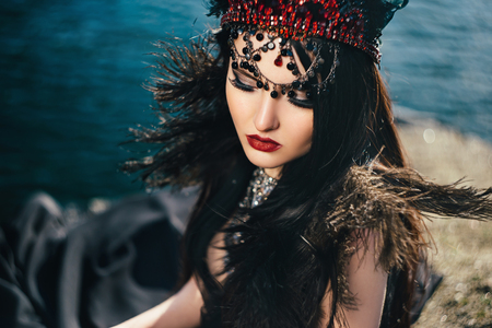 dark evil queen sneaks through the stone canyon at cosplay moviesnow white, wild Princess , vampire , hip toning , creative color,dark bohoの写真素材