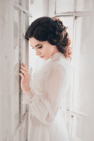 Lady in white vintage dress standing in a large spacious room, fantastic shot, fairytale princess turned into smoke, trendy toning, creative computer colors