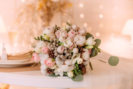 Beautiful bouquet bride in winter style. Unusual floral arrangement, pastel colors. Universal decor, festive mood.の写真素材