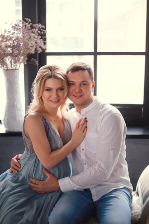 Husband and wife are expecting a baby. Fashionable toning.の写真素材