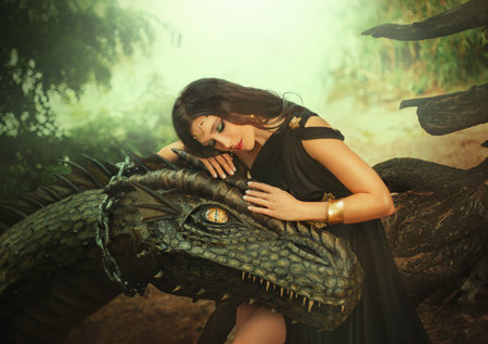 Fantasy woman evil dark queen witch hugs dragon, touching with hands head. Girl mistress tamed myth...
