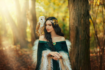 Art photo portrait Fantasy woman goddess elf, white bird owl barn owl sits on shoulder. Autumn...