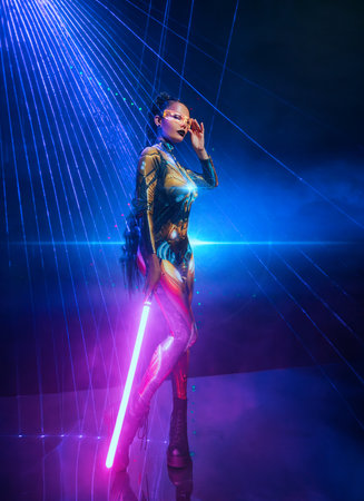 Fashion model posing Fantasy cyborg woman robot costume metal body creative glowing glasses eyes,...