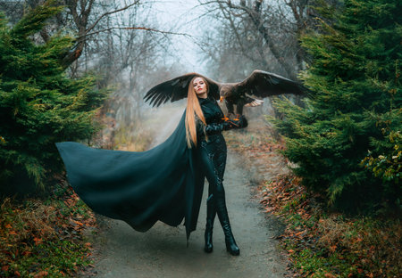 art portrait real people fantasy woman holding white-tailed eagle bird flaping open wings on hand....