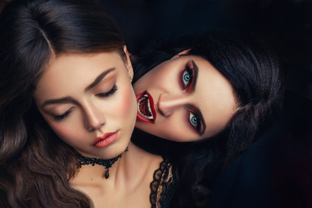 fantasy portrait face sexy vampire woman bites eating drinks young beauty lady death medieval girl. Horror night halloween Holiday scary bloody makeup red lips sharp teeth fangs open mouth evil eyesの写真素材