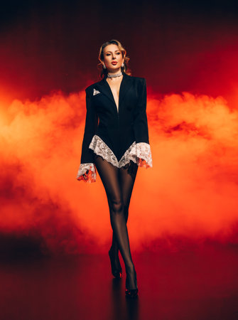 beauty woman strong face sexy fashion model posing for photo shoot dressed in black jacket white lace girl walking high heel shoes classic office core style, catwalk studio black background red lightの写真素材
