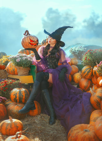 Art photo real person happy beauty young woman with orange pumpkin carved Jack O Lantern. fantasy...