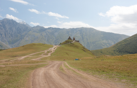 Tsminda Sameba- Holy Trinity Church near the Kazbegi-Gergeti village.The Church is situated at an altitude of 2300 meters at the foot of mount Kazbekのeditorial素材