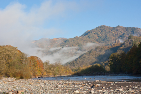 Autumn mountain landscape. Mountain river valley early in the morningの写真素材