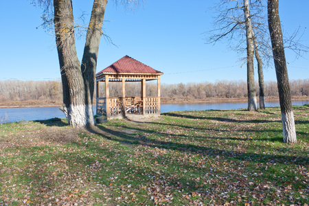 Wooden gazebo on the banks of the Don river. Sunny day in autumnの写真素材