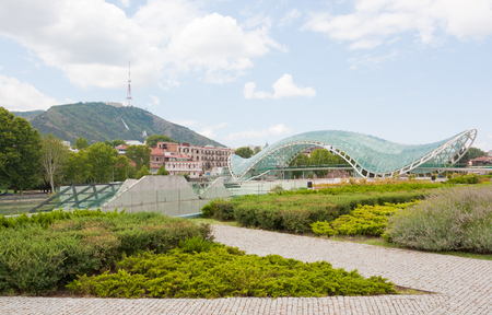 Tbilisi, Georgia - August 9, 2013: The Bridge of Peace . The bridge stretches over the Kura river and connects the areas of old city.のeditorial素材