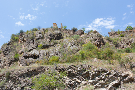 The mountainous landscape of South Georgia with the ruins of a medieval fortress Macawis-tsikheの写真素材
