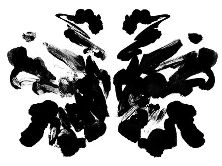 Mirror symmetrical black spots. Isolated on white backgroundの写真素材