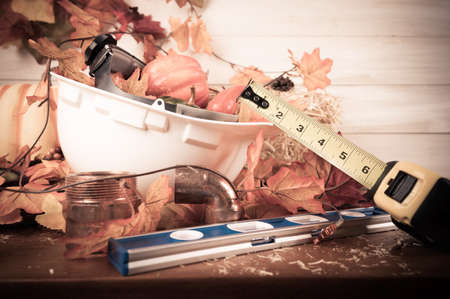 Happy Thanksgiving with construction tools, maple leaves and pumpkin on wood background.
Autumn composition with copy space. Plumber Thanksgiving.の写真素材