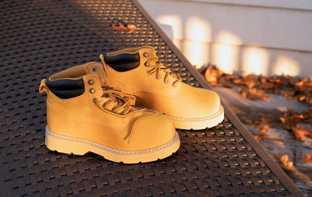 Pair of new boots yellow for foot, hard work or adventure travel.
work boots.