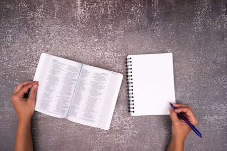 Bible Study and white notebook on a Old texture Table. Copy space text. Christian concept.の写真素材