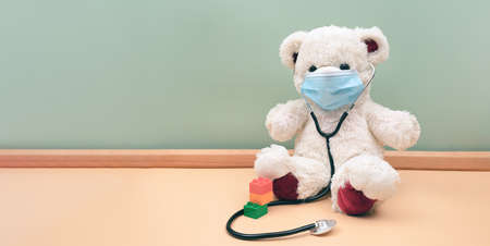 Pediatrician healthcare for children. Teddy bear with a stethoscope, toy and medical equipment.の写真素材