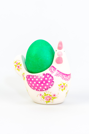 One painted egg in a decorative stand for Easterの写真素材