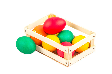 Wooden box with Easter multicolored eggsの写真素材
