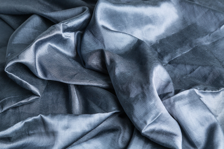 Smooth elegant blue silk or satin texture can use as abstract backgroundの写真素材
