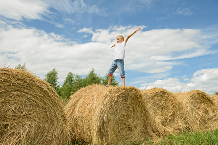 Happy childhood. A summer sunny day in the village.の写真素材