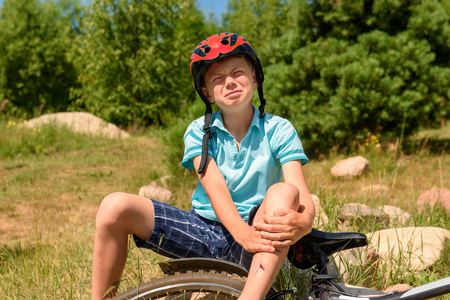 Teenager has fallen from bicycle and was traumatizedの写真素材