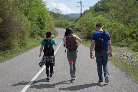 Travelers travel on the road in mountains go trekking together. Nature backgroundの写真素材
