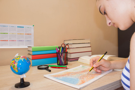 Education and school concept - little student girl with many booksの写真素材