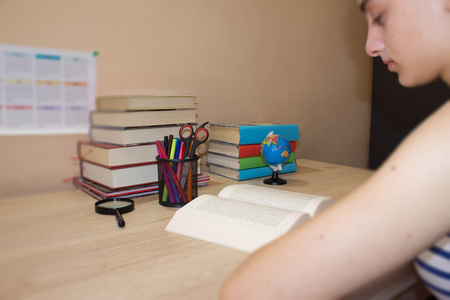 Young student Girl with lots of books studying for exams. Education conceptの写真素材
