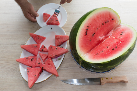 Organic Ripe Seedless Watermelon Cut into Wedges. Triangle shaped watermelon slicesの写真素材