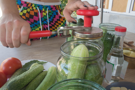 gurtsov conservation. Fresh cucumbers in jars. Process of cucumber conservationの写真素材