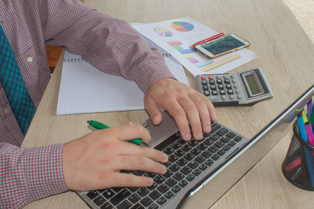 business accounting concept businesswoman and laptop with calculator on table working area. Man...