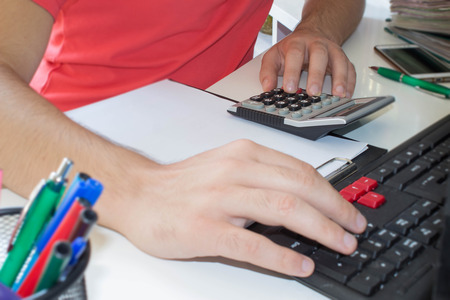 Businessman pressing computer button - financial analyzing concept. Finance, Business and accounting businessの写真素材