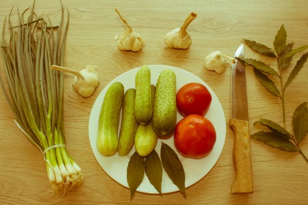 Green Cucumber. Include fresh organic vegetables on wooden floor. Fresh, raw vegetables on the table - Retro colorの写真素材