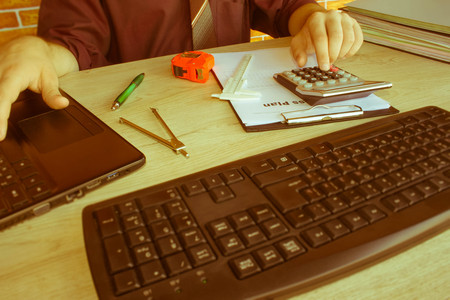 Businessman analyzing report, business performance concept. Businessperson working in office - Retro colorの写真素材