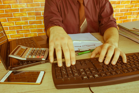 Business man doing finances on calculate analysis working with financial results Financial...