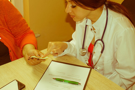 Doctor Discussing Records With Senior Female Patient. Medical and Health care concept. Doctor and...