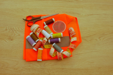 tailor workspace with sewing and handmade tools. tools for sewing for hobby - Retro color