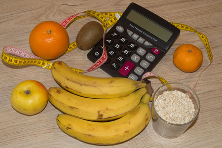 Diet concept. Fruits and vitamins with measuring tape. Healthy lifestyle diet with fresh fruitsの写真素材