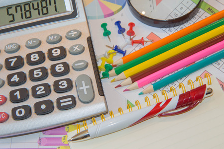 Calculator, pencil and pen on business documents, accounting and finance concept. Analyzing...