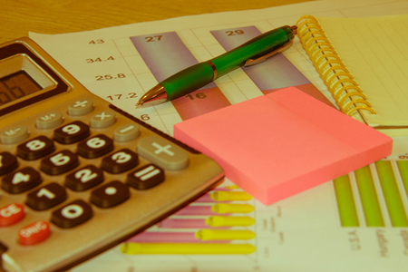 Close up business concept, Calculator, notebook, pen on financial report on table office. Business Balance Sheetの写真素材