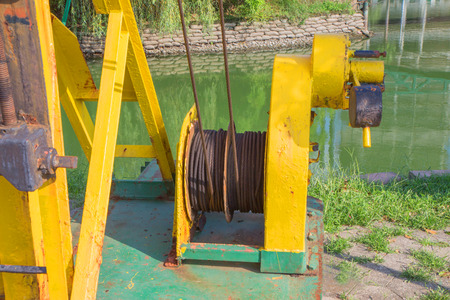 rusty, painted mechanism near the reservoir. Old rusty industrial equipment. Part of the metal...