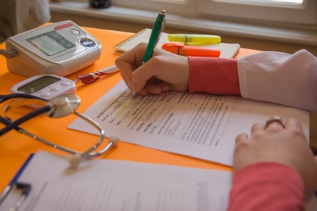 Doctor working in hospital writing a prescription. Healthcare and medical concept. Medicine doctor's...