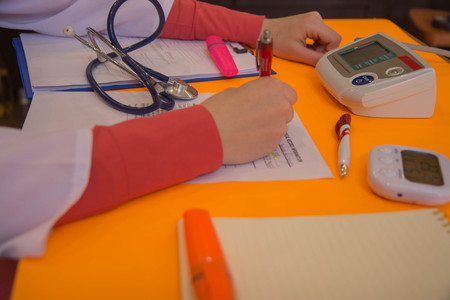 Doctor appoint prescription drugs to patients. Doctor working at table in office. Concept photo doctorの写真素材