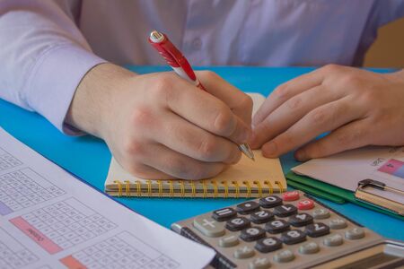 Man Analyzing Statistics Financial Concept. The calculators, business owners, accounting and technology, businessの写真素材