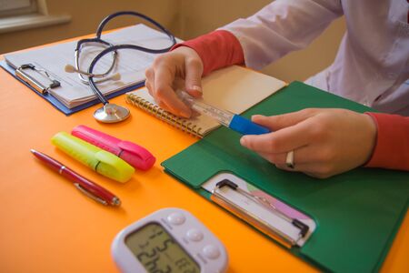Medicine doctor's working place. Shot of female medical doctor's hands. Healthcare and medical conceptの写真素材