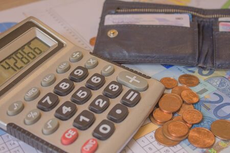 Business, finance, saving money or investment concept: Coin stacks, pen and savings account passbook...