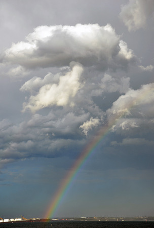 Rainbow and storm clouds over the Bayの写真素材